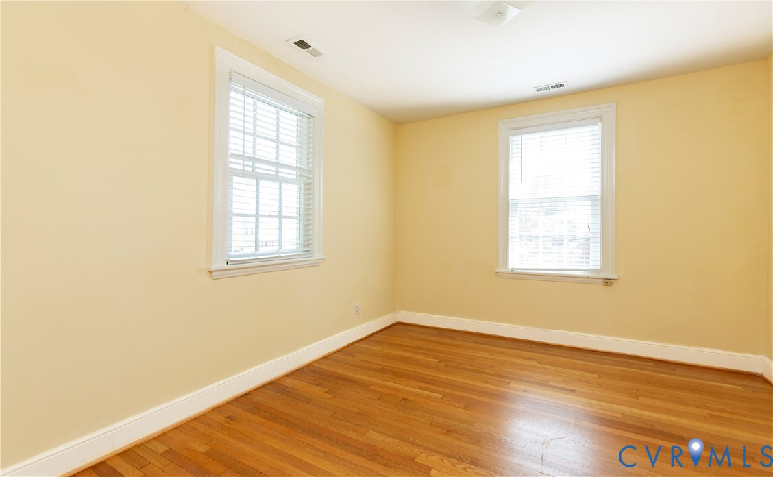 4801 Brook Road Richmond, VA 23227 - Photo 16 of 28 a view of an empty room with wooden floor and a window