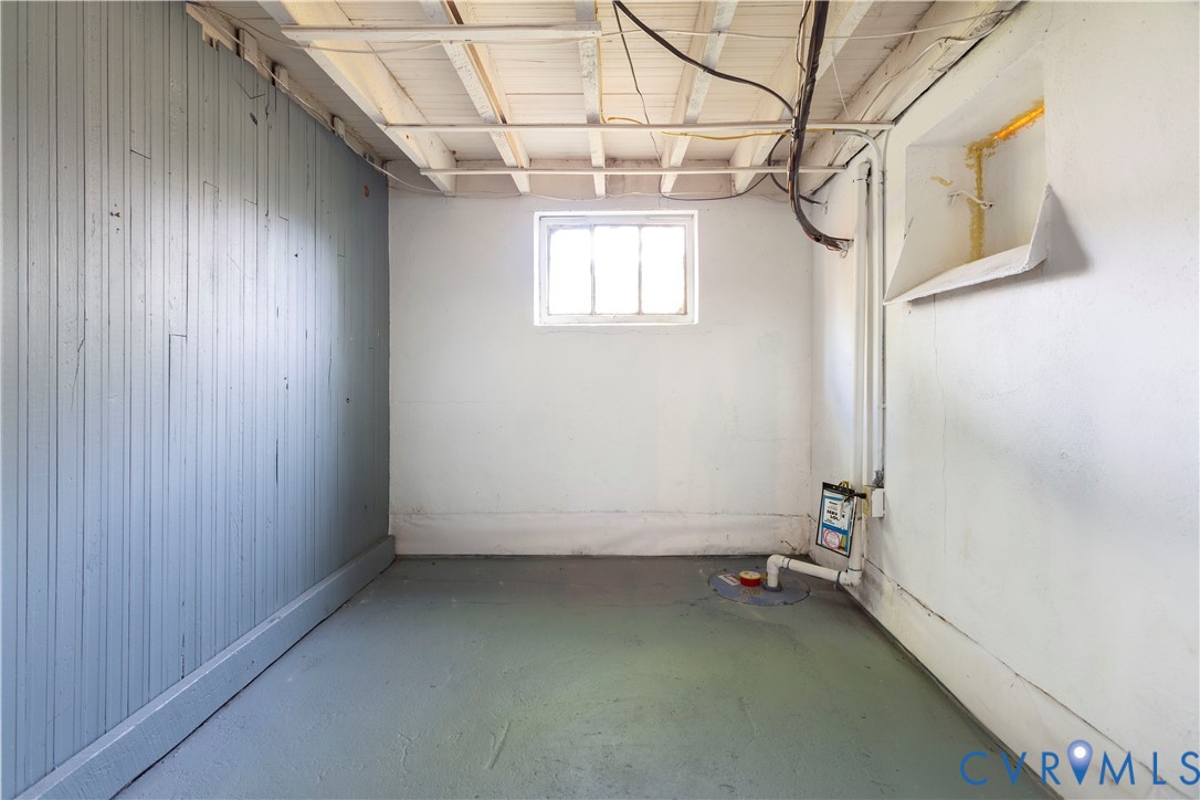 4801 Brook Road Richmond, VA 23227 - Photo 22 of 28 a view of a room with racks on the wall and a window