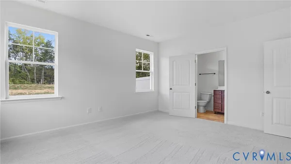 a view of empty room with windows