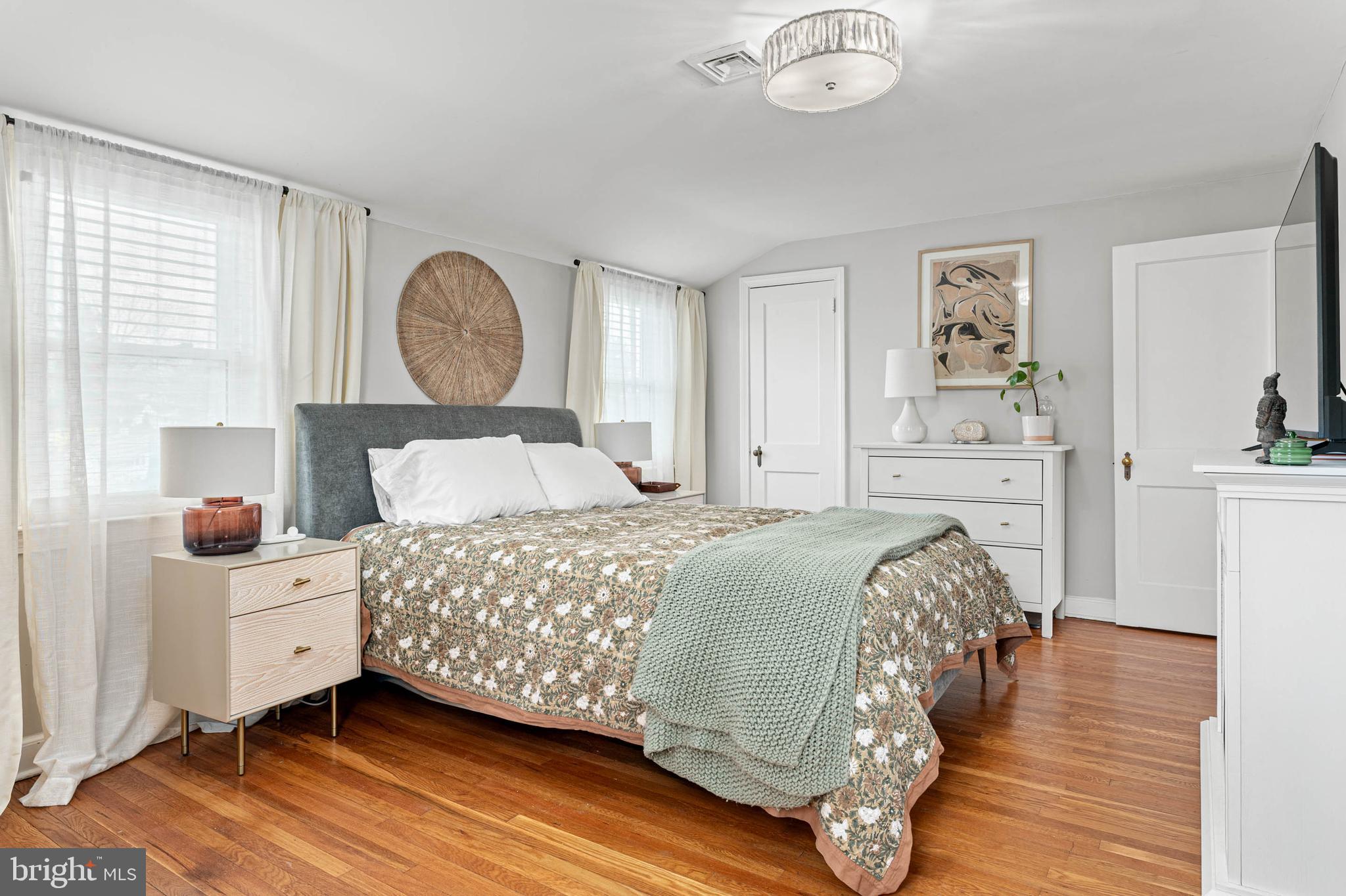 21 Moreland Road Paoli, PA 19301 - Photo 15 of 29 a bedroom with a bed and a chandelier