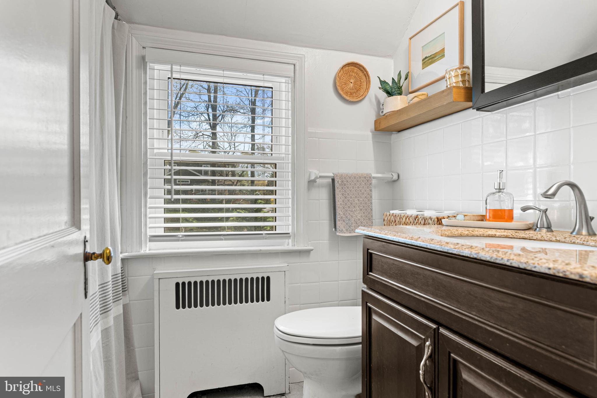 21 Moreland Road Paoli, PA 19301 - Photo 22 of 29 a bathroom with a sink a toilet and a window