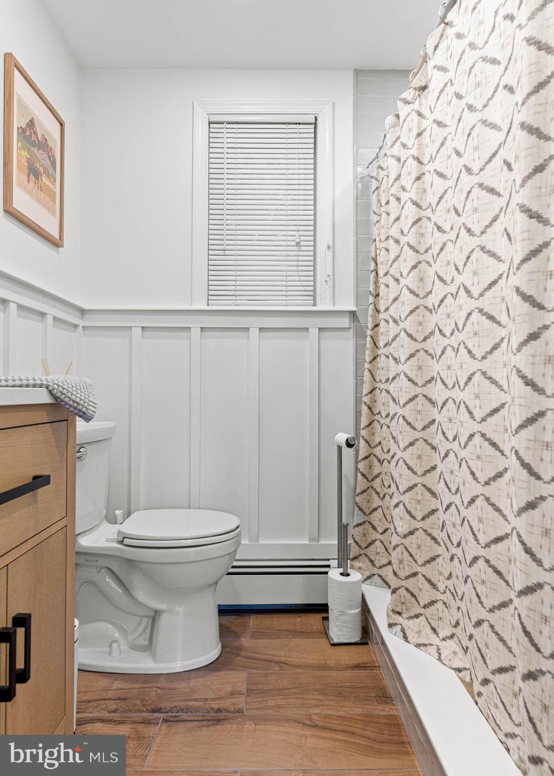 21 Moreland Road Paoli, PA 19301 - Photo 23 of 29 a bathroom with a toilet and a shower curtain