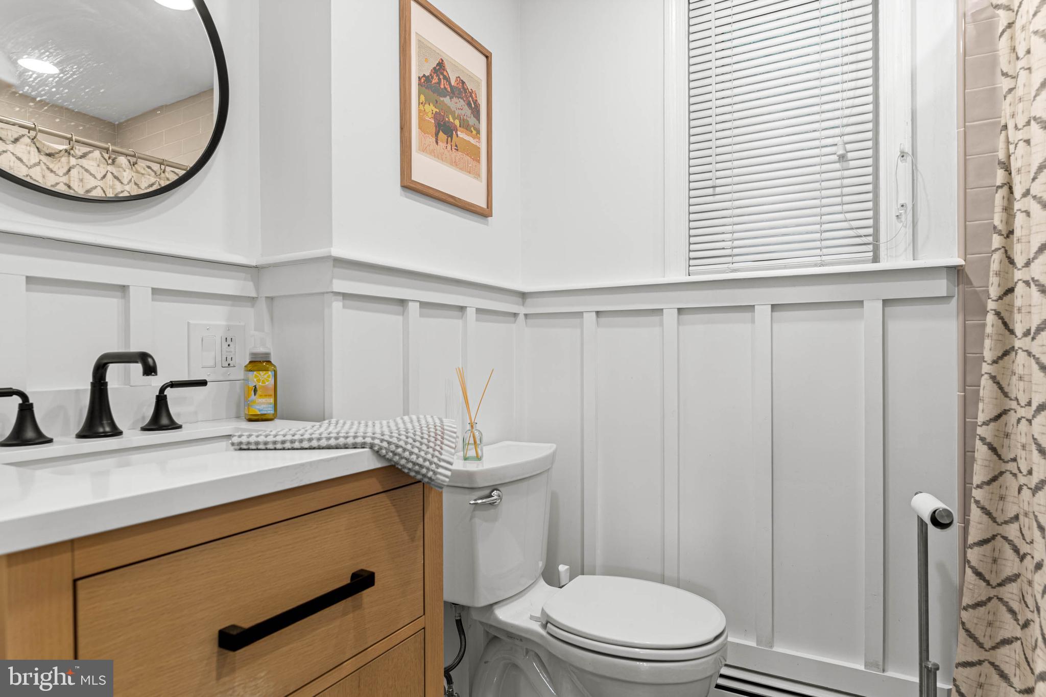 21 Moreland Road Paoli, PA 19301 - Photo 24 of 29 a bathroom with a sink a toilet and a mirror