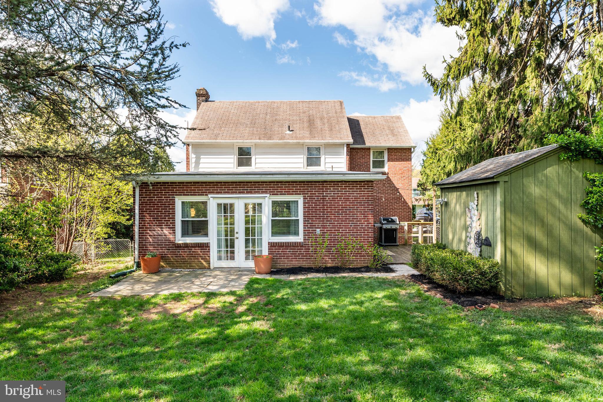 21 Moreland Road Paoli, PA 19301 - Photo 25 of 29 a view of a house with a yard and plants