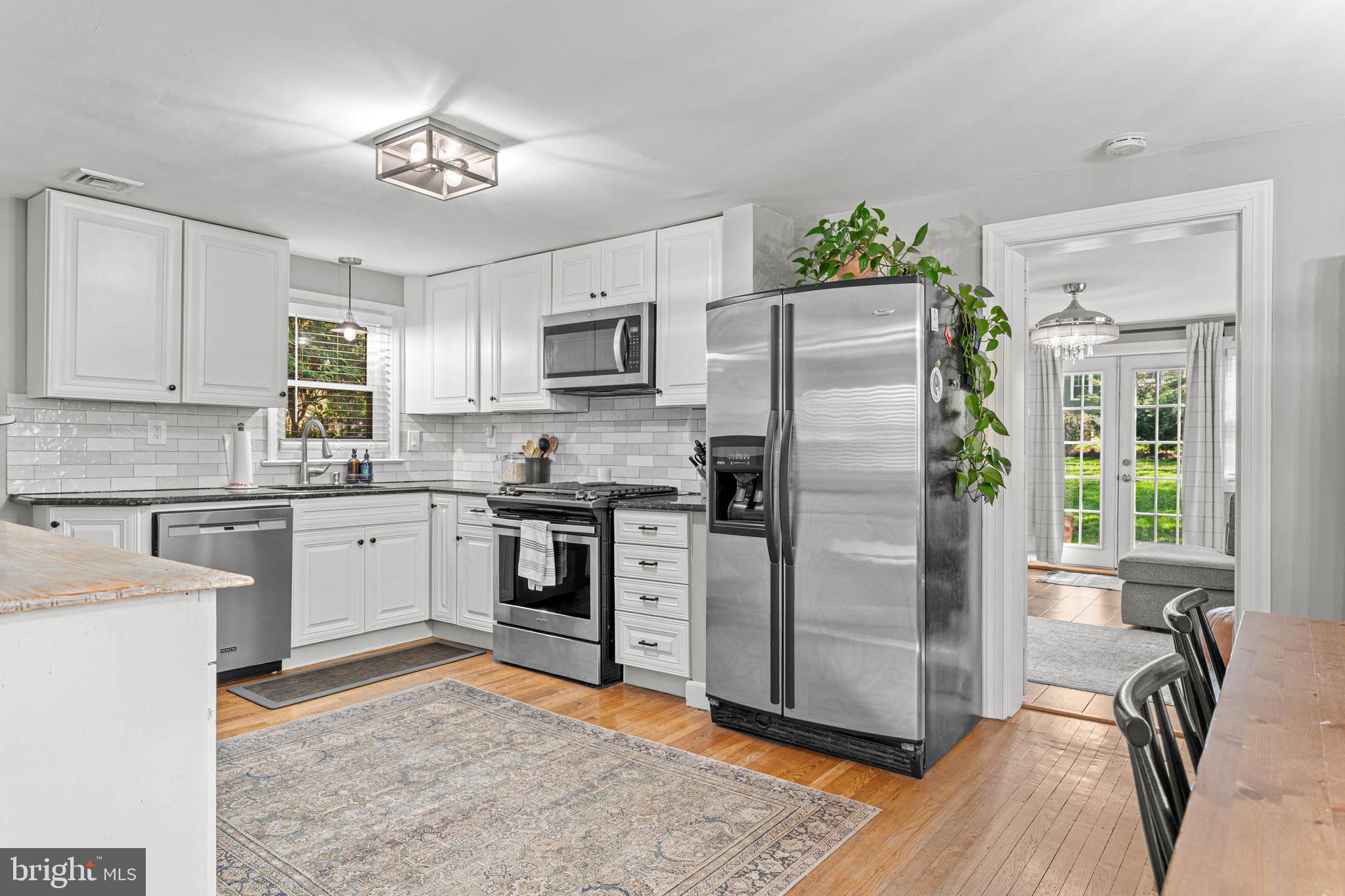 21 Moreland Road Paoli, PA 19301 - Photo 7 of 29 a kitchen with a refrigerator stove and sink