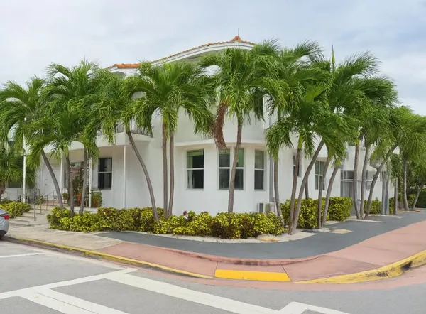 front view of a house next to a yard
