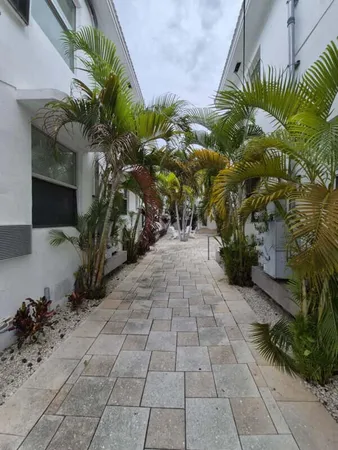 a view of a backyard of the house