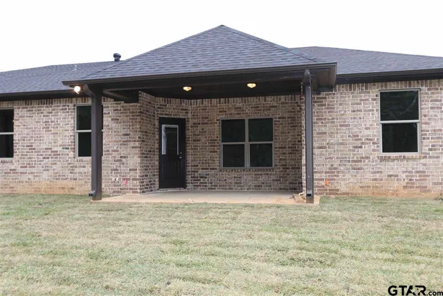a front view of a stone house