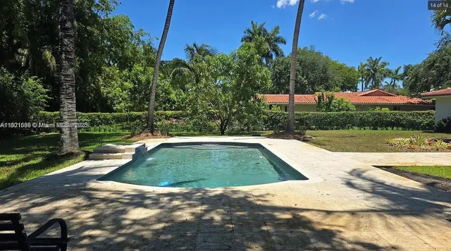 a view of outdoor space with swimming pool