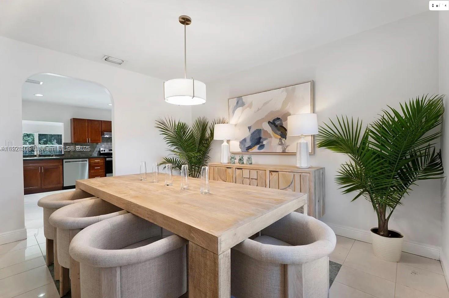 8700 Southwest 64th Avenue Pinecrest, FL 33156 - Photo 8 of 14 a view of kitchen and dining room with furniture