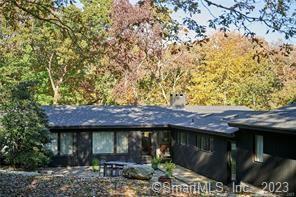 a view of a table and chairs under an umbrella