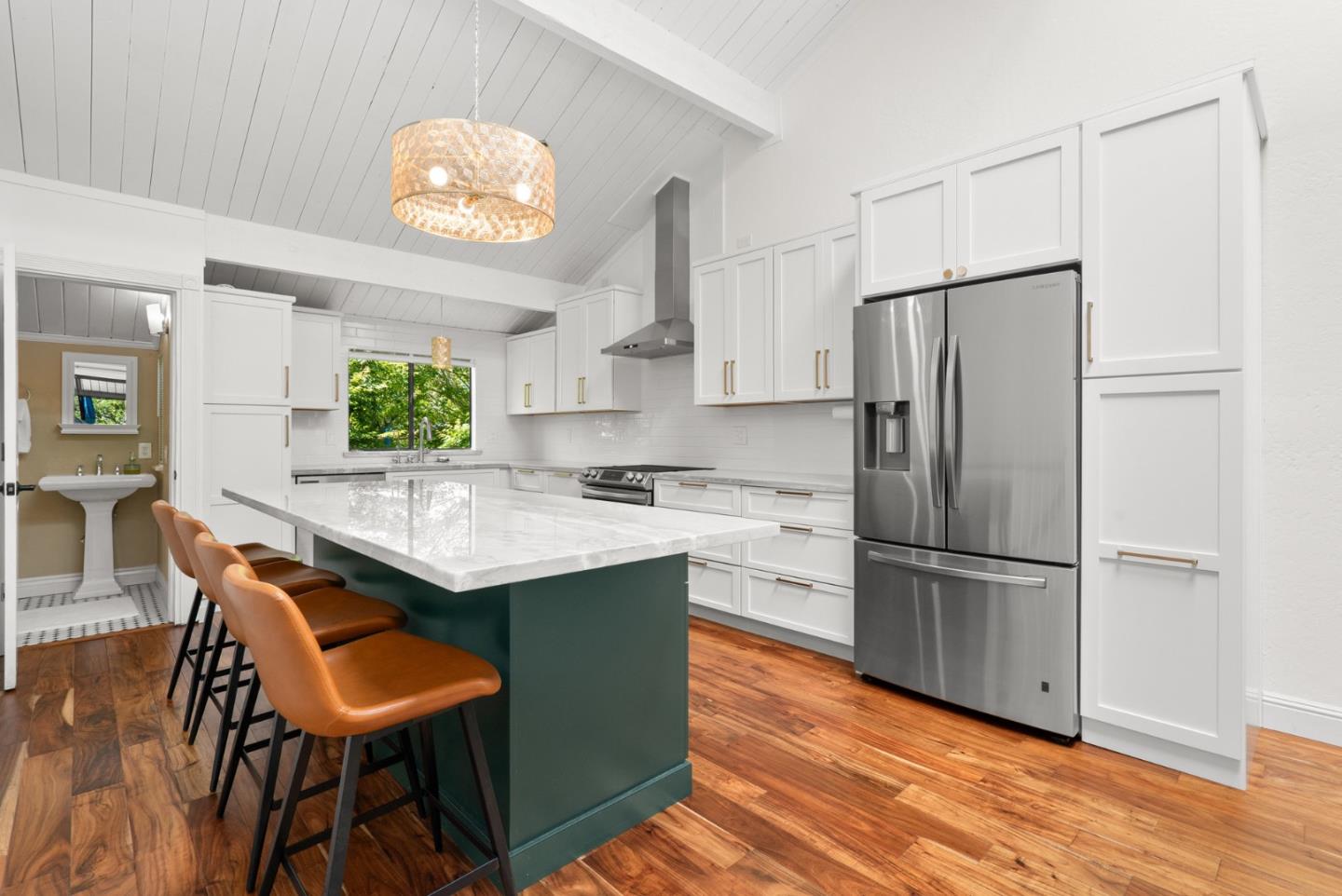 102 Tree Frog Lane Santa Cruz, CA 95060 - Photo 11 of 51 a kitchen with stainless steel appliances granite countertop a refrigerator a sink dishwasher a stove a dining table and chairs with wooden floor