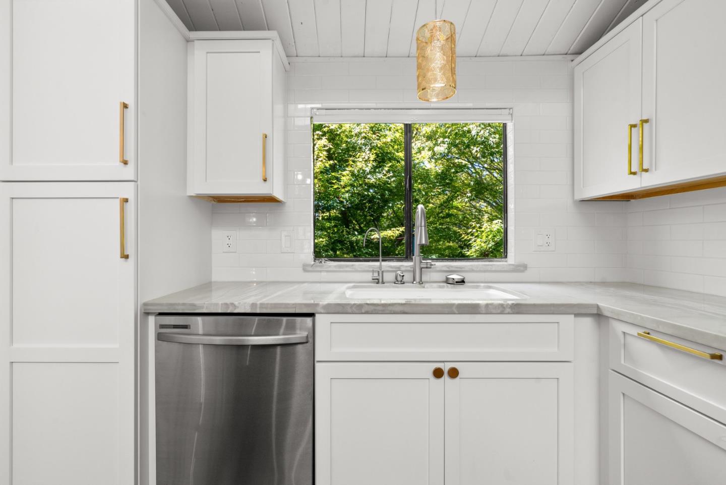 102 Tree Frog Lane Santa Cruz, CA 95060 - Photo 16 of 51 a kitchen with a sink and a window