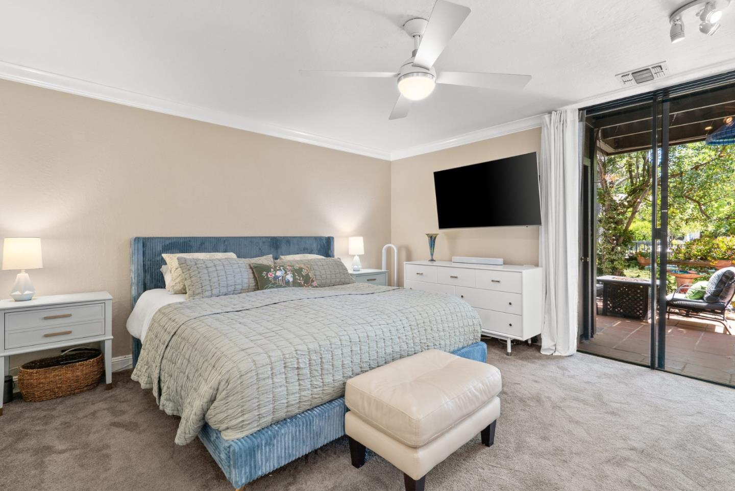 102 Tree Frog Lane Santa Cruz, CA 95060 - Photo 23 of 51 a bedroom with a bed and a flat screen tv