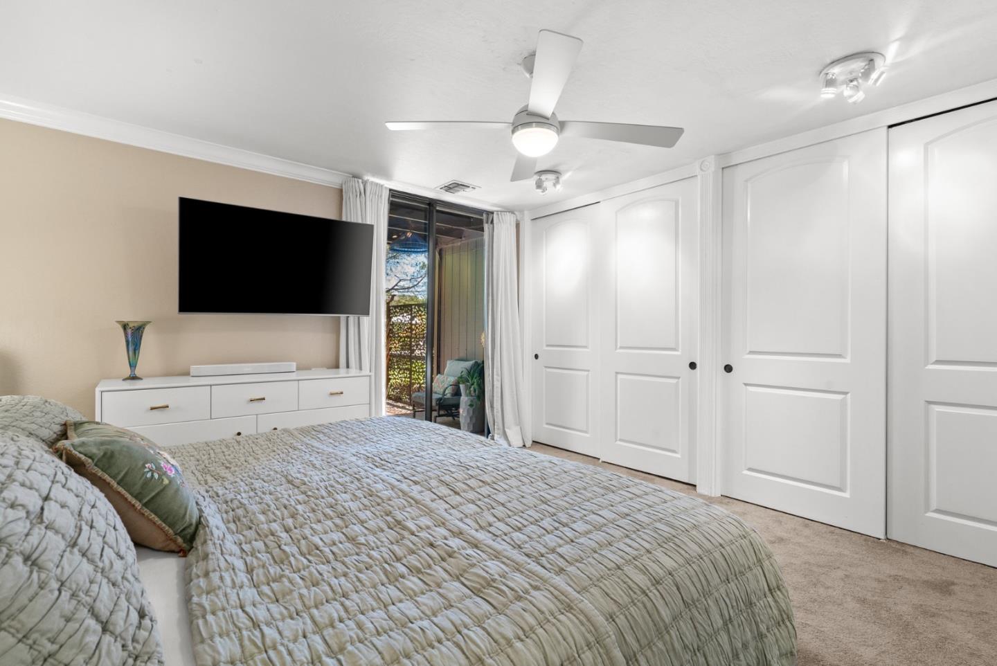 102 Tree Frog Lane Santa Cruz, CA 95060 - Photo 24 of 51 a bedroom with a bed and a flat screen tv
