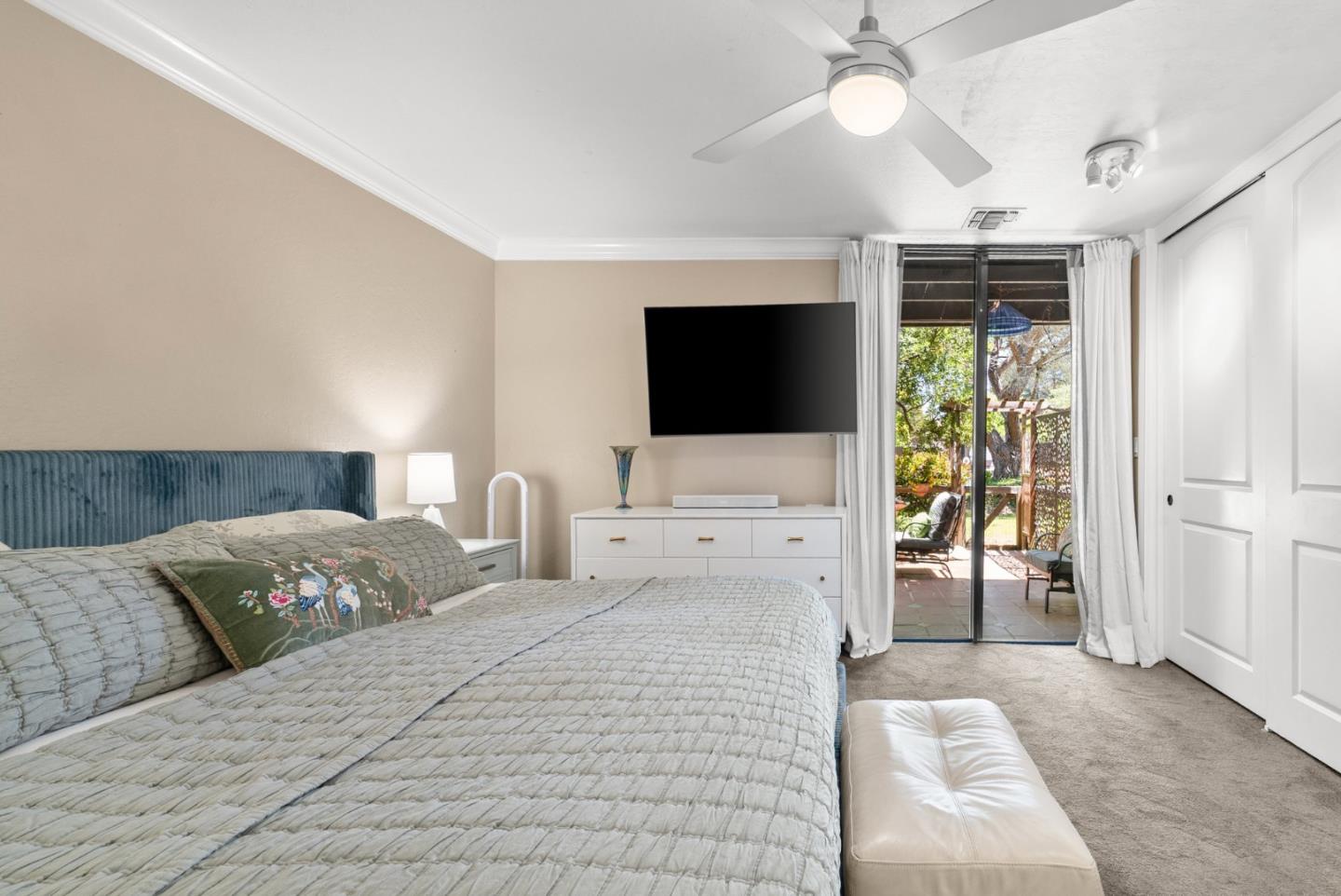 102 Tree Frog Lane Santa Cruz, CA 95060 - Photo 25 of 51 a bedroom with a bed and a flat screen tv