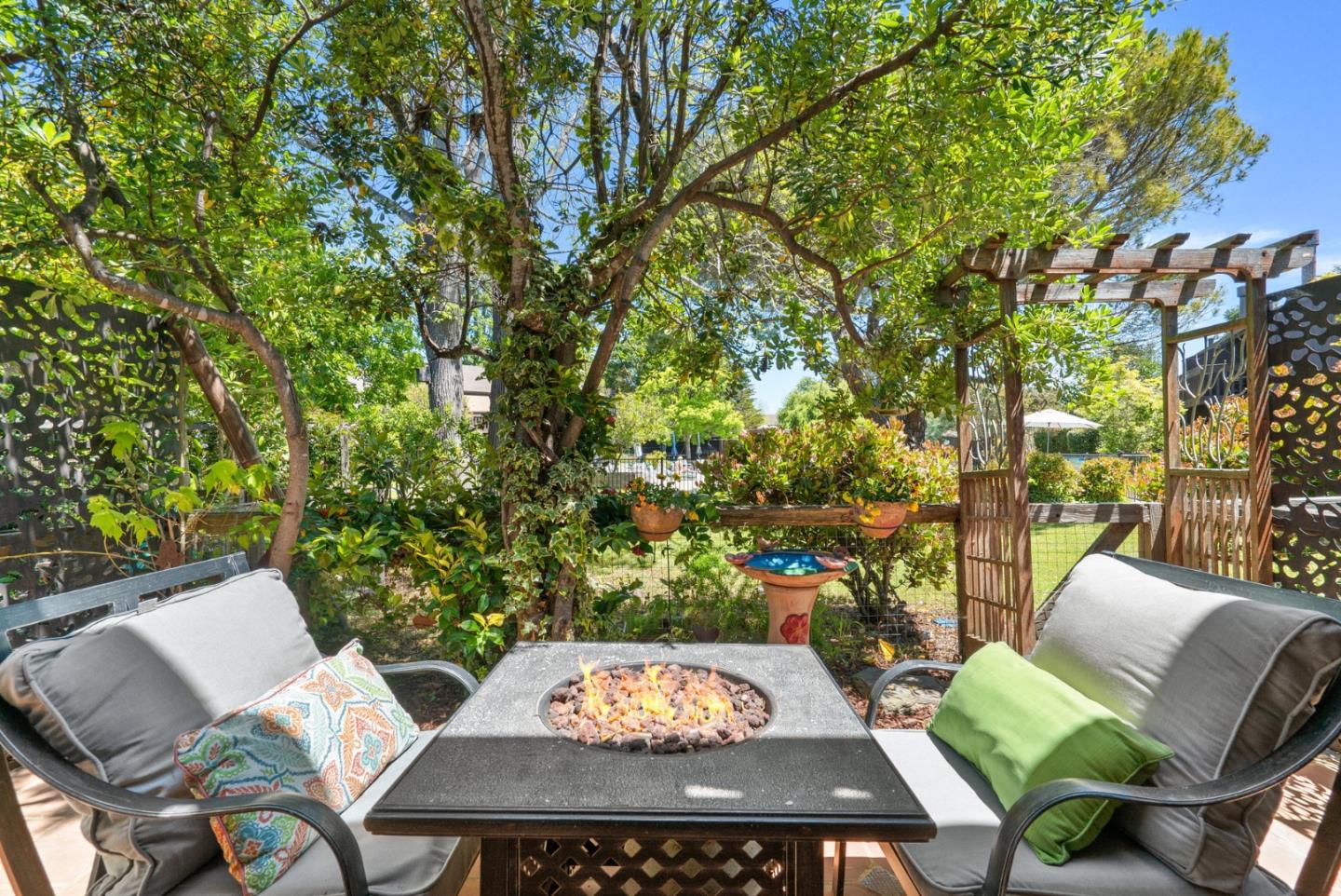 102 Tree Frog Lane Santa Cruz, CA 95060 - Photo 30 of 51 a view of a patio with table and chairs and potted plants