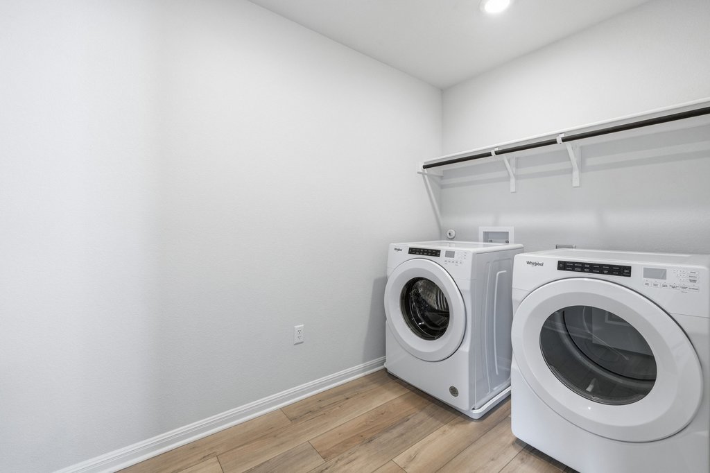 8001 Andravida Drive Austin, TX 78747 - Photo 27 of 35 Thoughtfully located upstairs laundry room on the same level as the primary suite for everyday convenience