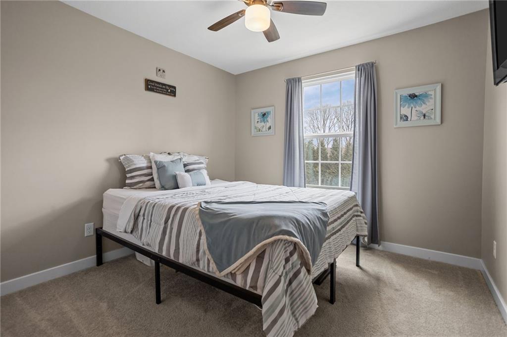 1075 Blackhawk Road Valencia, PA 16059 - Photo 17 of 25 a bedroom with a bed and a ceiling fan