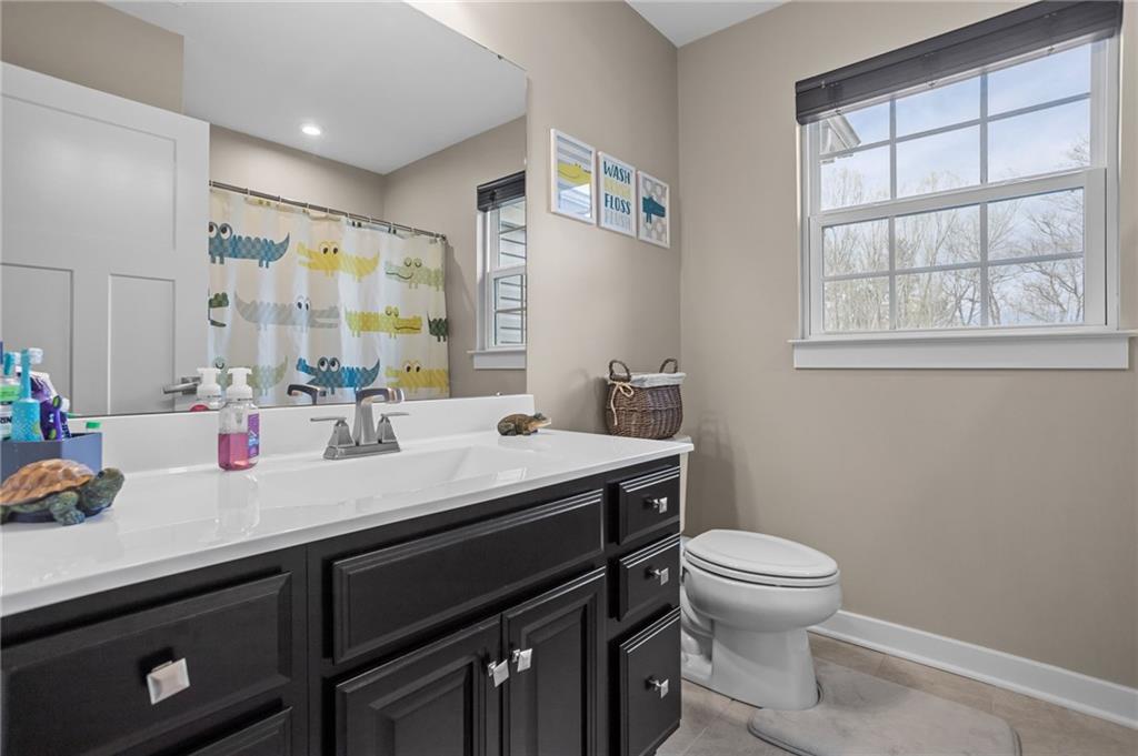 1075 Blackhawk Road Valencia, PA 16059 - Photo 18 of 25 a bathroom with a sink a toilet and a mirror