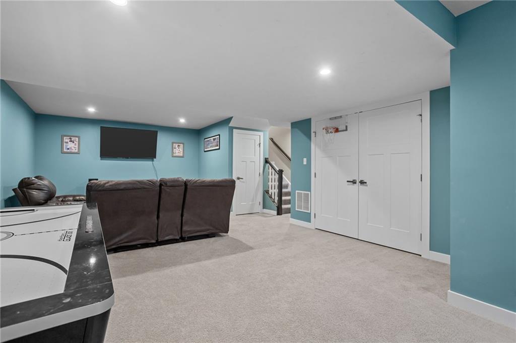 1075 Blackhawk Road Valencia, PA 16059 - Photo 19 of 25 a living room with furniture and a flat screen tv