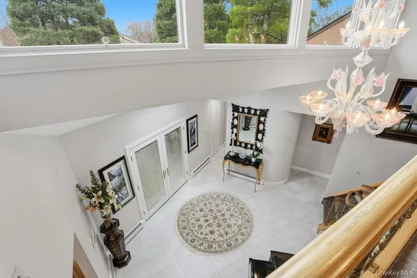 a view of a livingroom with furniture and a window