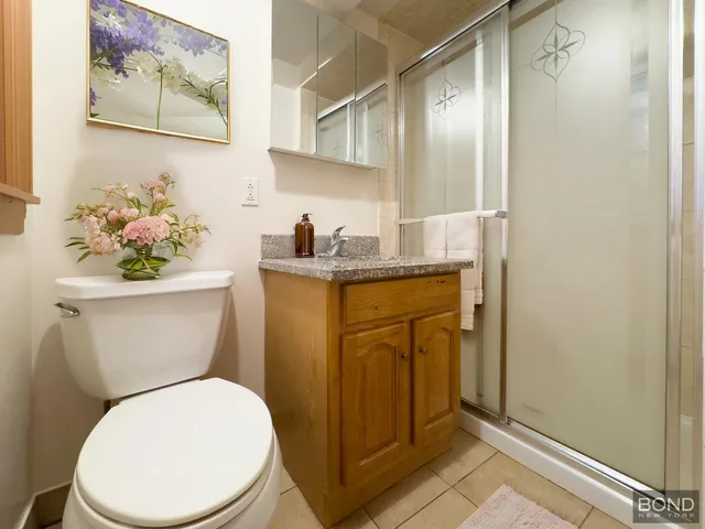 a white toilet sitting next to a bathroom sink