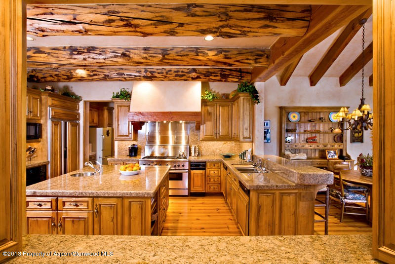 10 Ridge Place Aspen, CO 81612 - Photo 12 of 37 a living room with stainless steel appliances kitchen island granite countertop a table and chairs