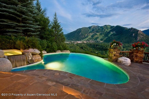 10 Ridge Place Aspen, CO 81612 - Photo 18 of 37 a view of a swimming pool with a yard and a fountain