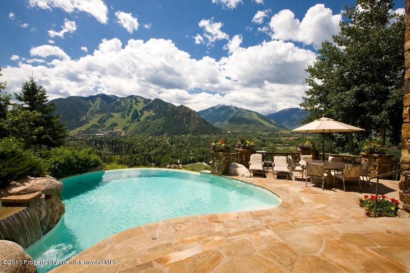 10 Ridge Place Aspen, CO 81612 - Photo 19 of 37 a view of a swimming pool and lounge chairs