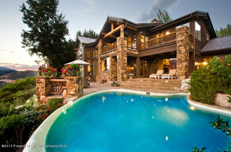 10 Ridge Place Aspen, CO 81612 - Photo 2 of 37 a swimming pool with outdoor seating and yard