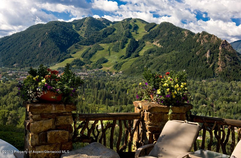 10 Ridge Place Aspen, CO 81612 - Photo 28 of 37 a view of a balcony with chairs and wooden fence