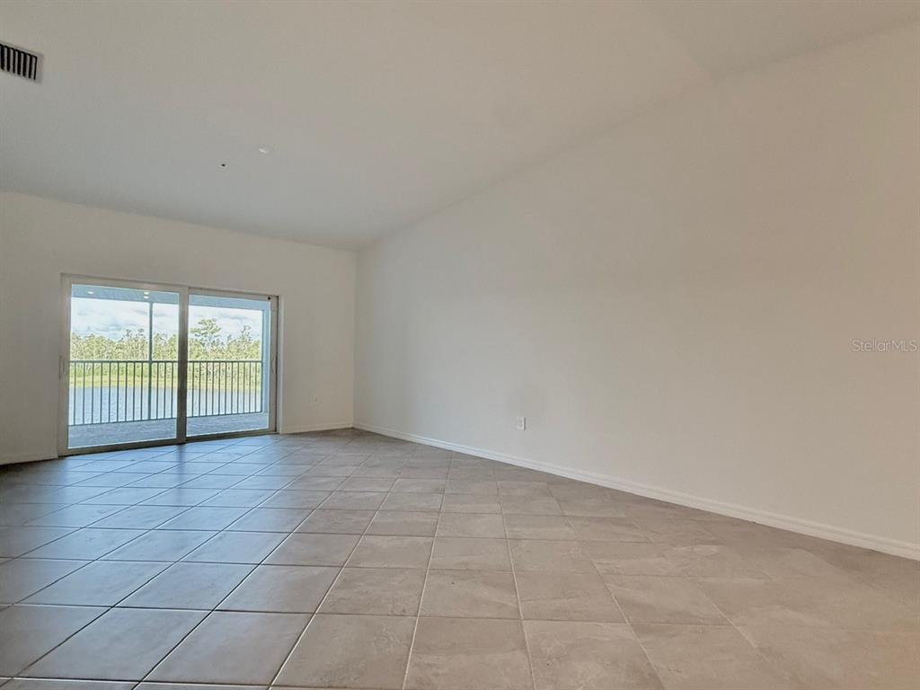 14261 Heritage Landing Boulevard, Unit 1621 Punta Gorda, FL 33955 - Photo 18 of 55 an empty room with windows