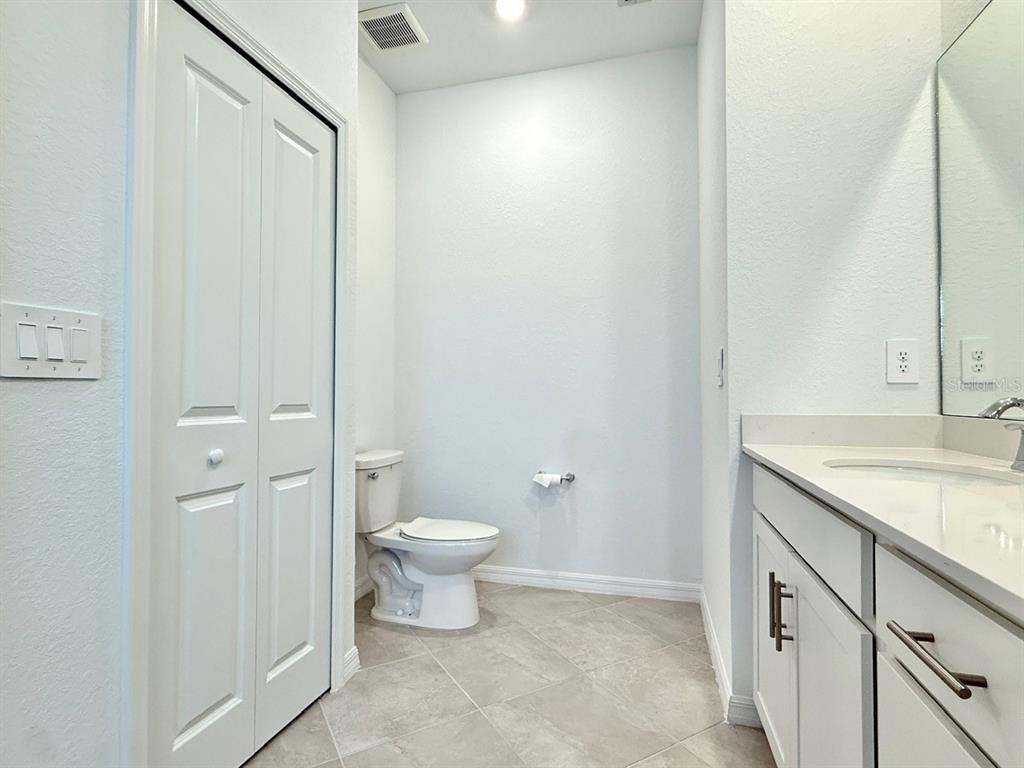 14261 Heritage Landing Boulevard, Unit 1621 Punta Gorda, FL 33955 - Photo 20 of 55 a bathroom with a granite countertop sink toilet and shower