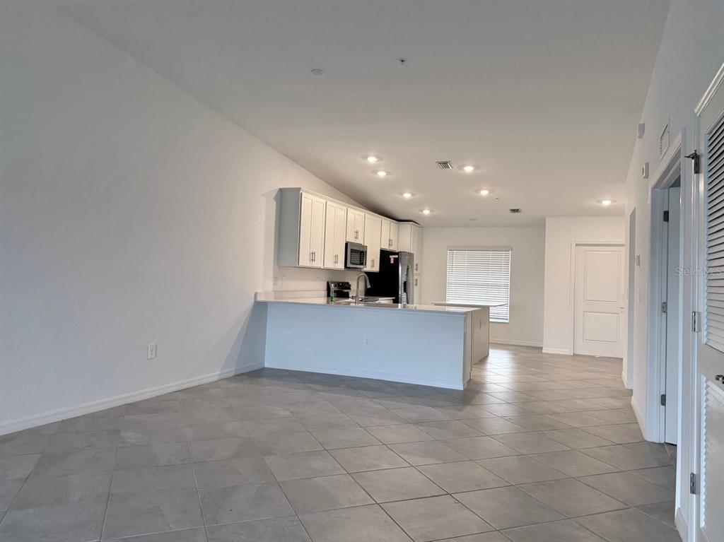 14261 Heritage Landing Boulevard, Unit 1621 Punta Gorda, FL 33955 - Photo 23 of 55 a view of kitchen with kitchen island sink and center island