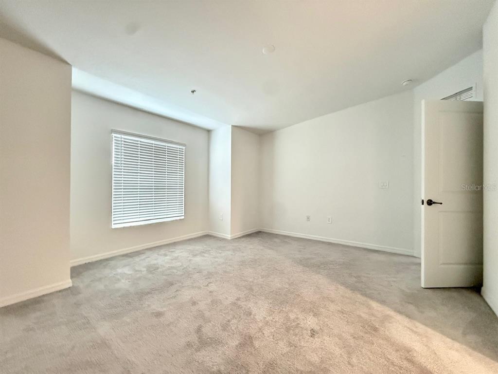 14261 Heritage Landing Boulevard, Unit 1621 Punta Gorda, FL 33955 - Photo 33 of 55 an empty room with windows