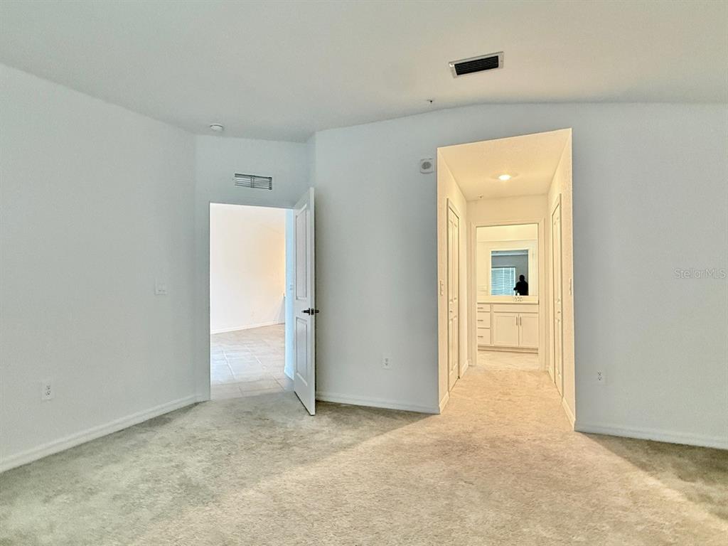 14261 Heritage Landing Boulevard, Unit 1621 Punta Gorda, FL 33955 - Photo 34 of 55 an empty room with closet and a bathroom