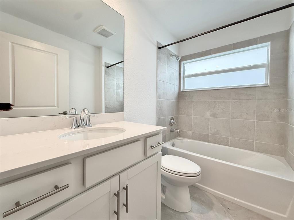 14261 Heritage Landing Boulevard, Unit 1621 Punta Gorda, FL 33955 - Photo 41 of 55 a bathroom with a sink a toilet and a bathtub