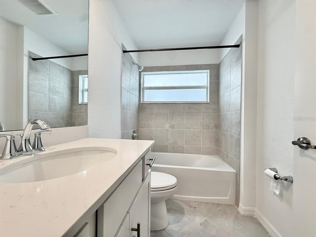 14261 Heritage Landing Boulevard, Unit 1621 Punta Gorda, FL 33955 - Photo 42 of 55 a bathroom with a sink a toilet and shower