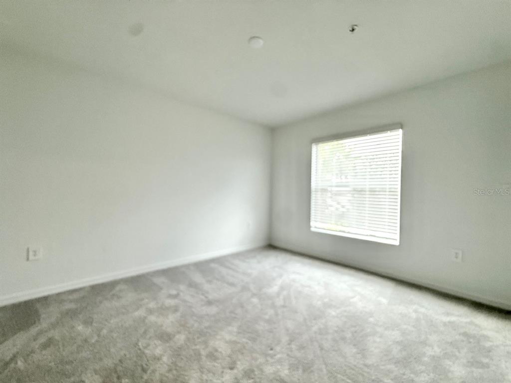 14261 Heritage Landing Boulevard, Unit 1621 Punta Gorda, FL 33955 - Photo 45 of 55 an empty room with a window