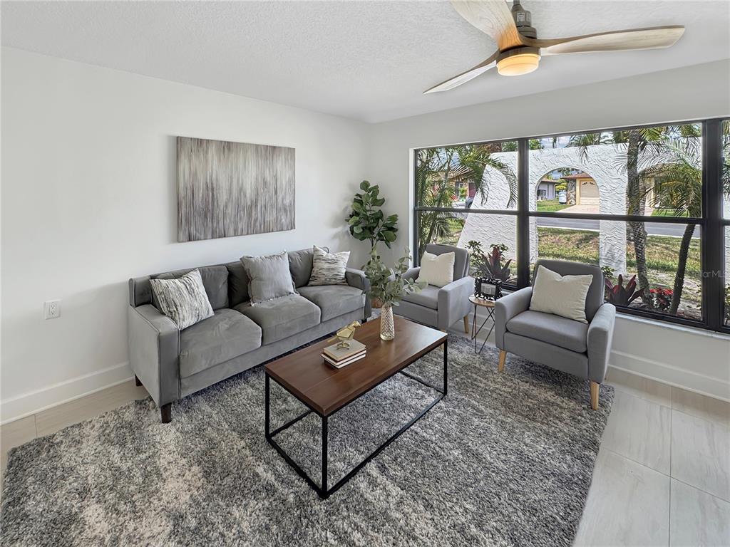 Undisclosed Address Port Richey, FL 34668 - Photo 11 of 44 a living room with furniture and a large window