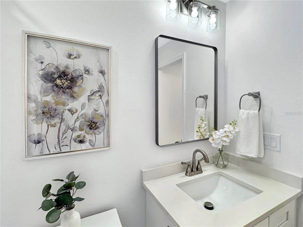 Undisclosed Address Port Richey, FL 34668 - Photo 12 of 44 a bathroom with a sink and a mirror