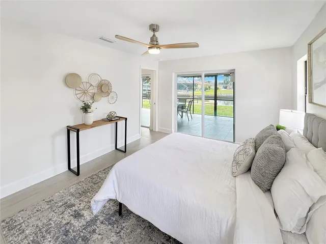 a bedroom with a bed and a table