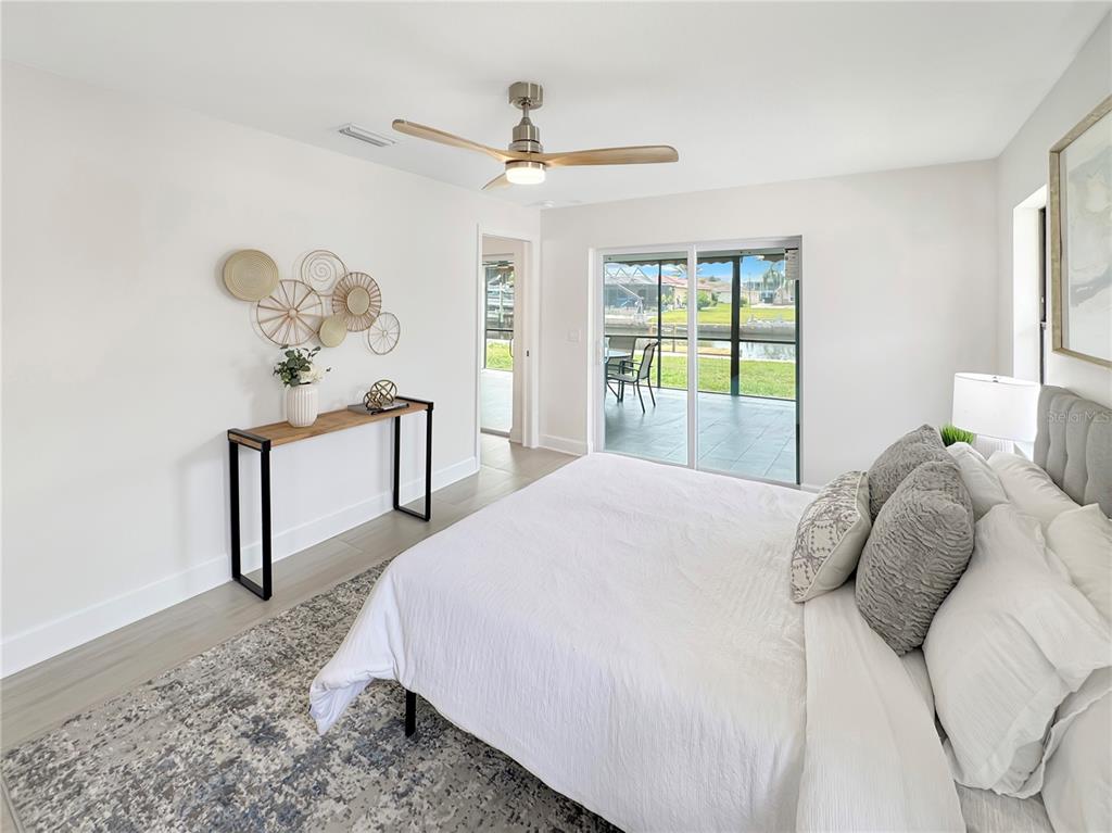 Undisclosed Address Port Richey, FL 34668 - Photo 13 of 44 a bedroom with a bed and a table