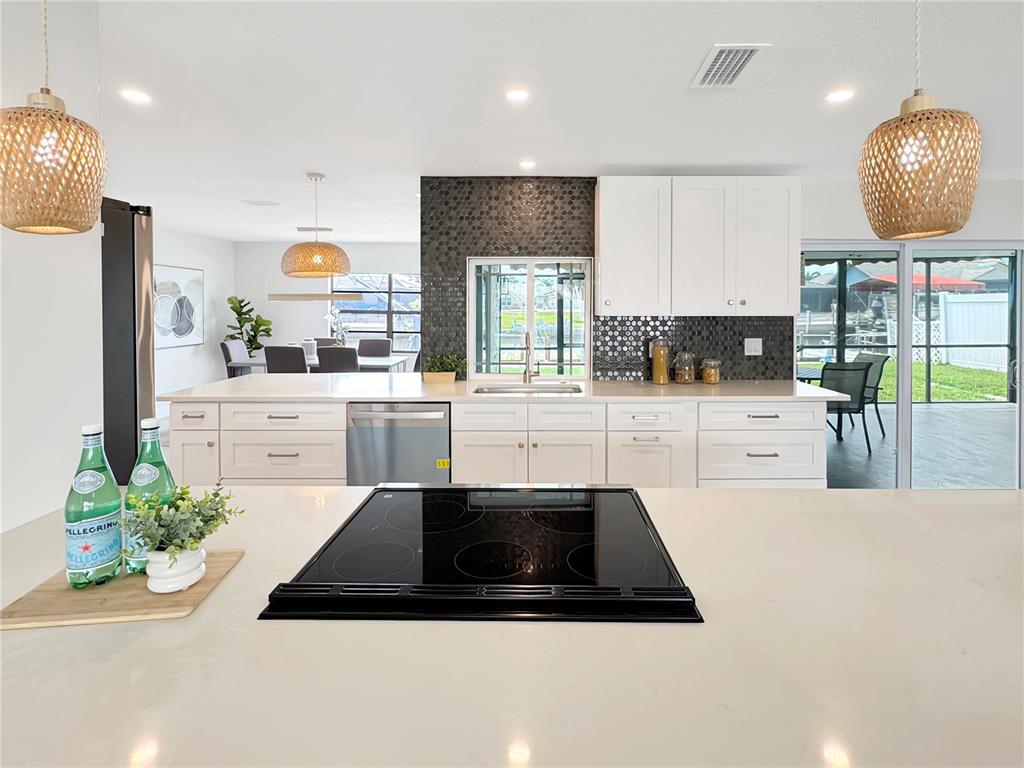 Undisclosed Address Port Richey, FL 34668 - Photo 15 of 44 a kitchen with a sink a counter space and stainless steel appliances