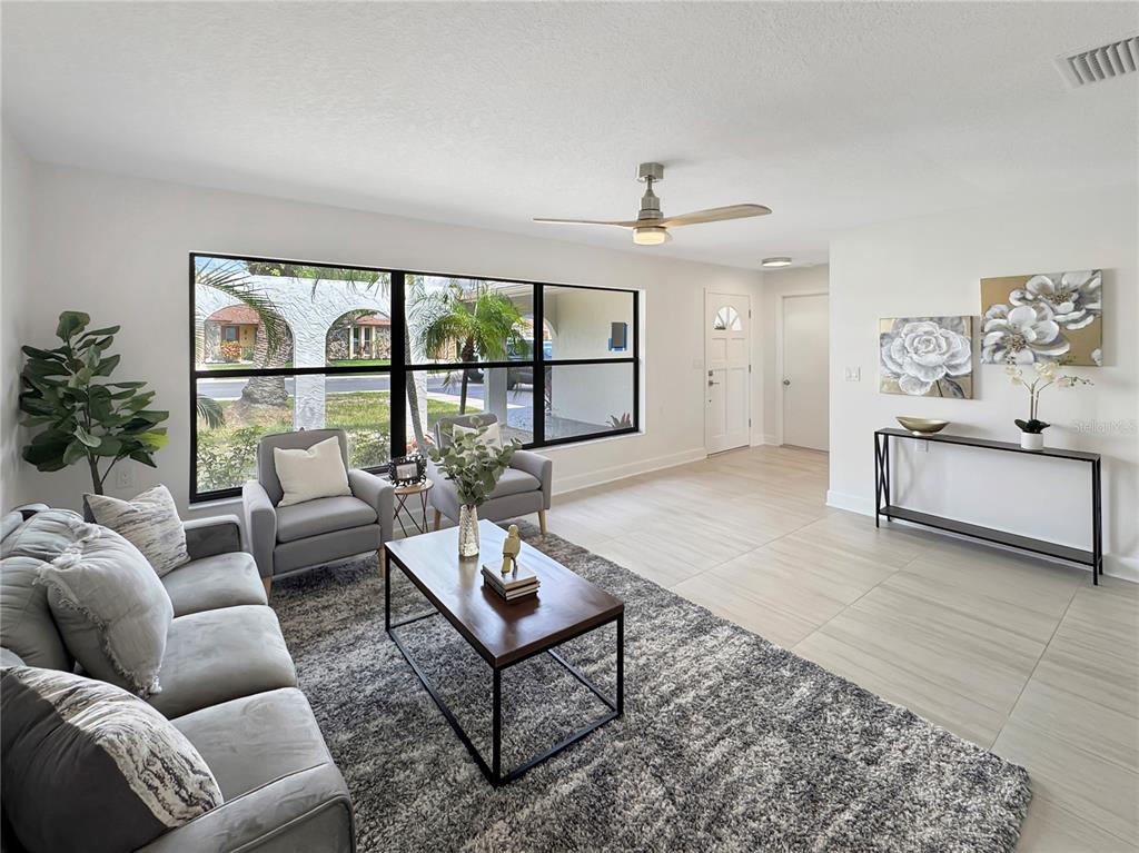 Undisclosed Address Port Richey, FL 34668 - Photo 16 of 44 a living room with furniture and a large window