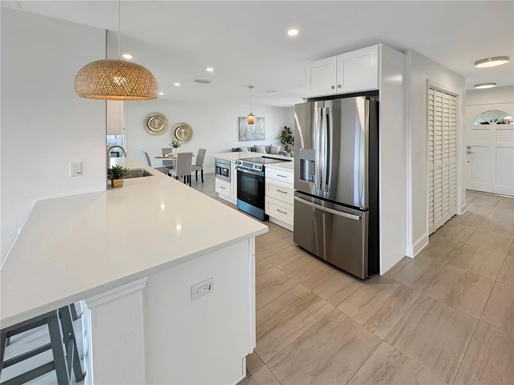 Undisclosed Address Port Richey, FL 34668 - Photo 17 of 44 a kitchen with kitchen island a counter space and stainless steel appliances