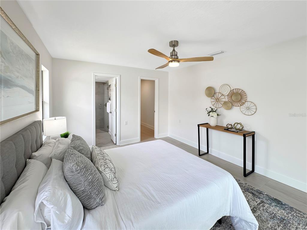 Undisclosed Address Port Richey, FL 34668 - Photo 21 of 44 a bedroom with a bed dresser and a window