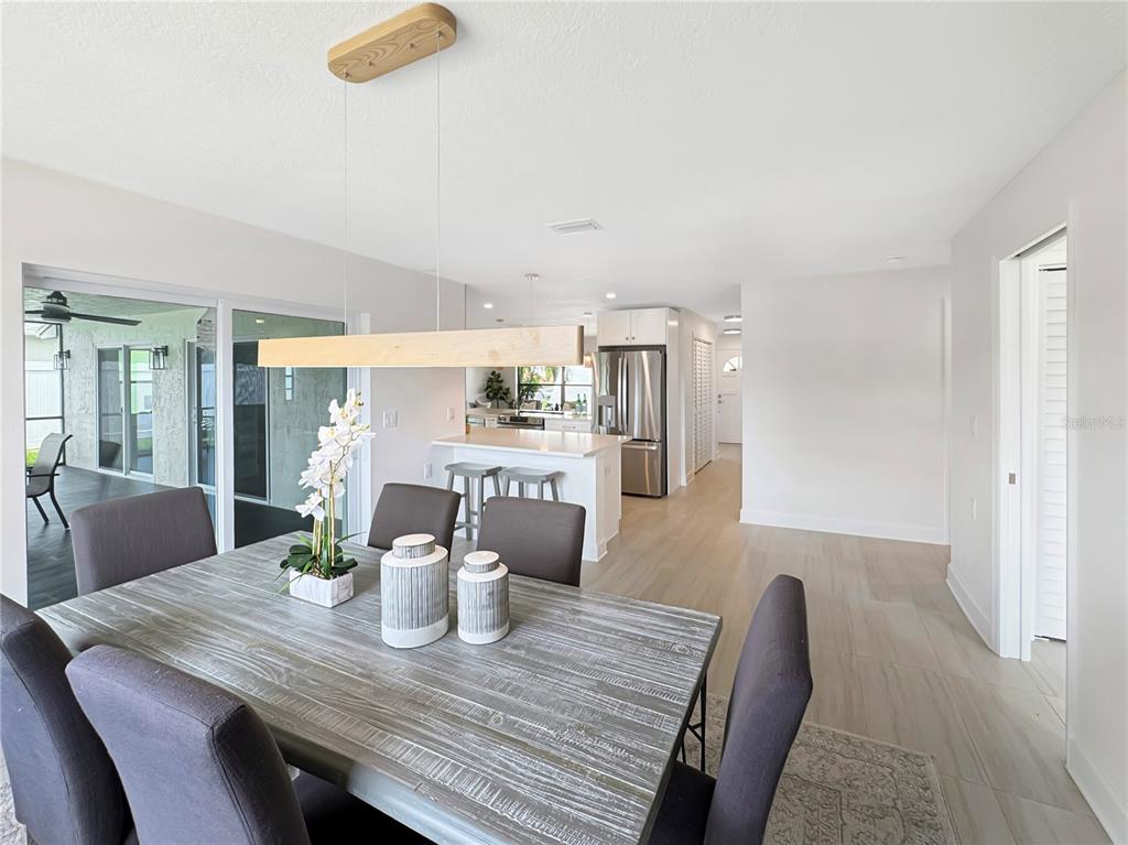 Undisclosed Address Port Richey, FL 34668 - Photo 23 of 44 a dining room with furniture and wooden floor