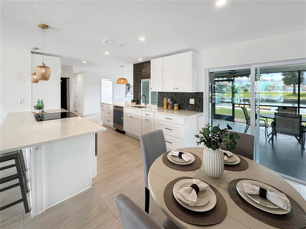 Undisclosed Address Port Richey, FL 34668 - Photo 25 of 44 a kitchen with a table and chairs in it